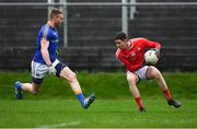 5 January 2019; Ciarán Downey of Louth in action against Shane Donohoe of Longford during the Bord na Móna O'Byrne Cup Round 3 match between Longford and Louth at Glennon Brothers Pearse Park in Longford. Photo by Piaras Ó Mídheach/Sportsfile