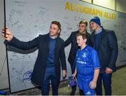 5 January 2019; Leinster players Jonathan Sexton, Garry Ringrose and Jordan Larmour with young supporter Daniel Hall, age 10, from Rathmines, Dublin, in 'Autograph Alley' prior to the Guinness PRO14 Round 13 match between Leinster and Ulster at the RDS Arena in Dublin. Photo by Seb Daly/Sportsfile