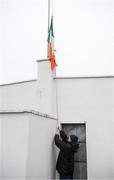 6 January 2019; Sean McGoldrick raises the tricolour, which is being flown at half mast in memory of the late Brian Mulvey, prior to the Connacht FBD League Preliminary Round match between Leitrim and Mayo at Avantcard Páirc Seán Mac Diarmada in Carrick-on-Shannon, Co Leitrim. Photo by Stephen McCarthy/Sportsfile