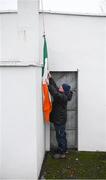 6 January 2019; Sean McGoldrick prepares to raise the tricolour, which is being flown at half mast in memory of the late Brian Mulvey, prior to the Connacht FBD League Preliminary Round match between Leitrim and Mayo at Avantcard Páirc Seán Mac Diarmada in Carrick-on-Shannon, Co Leitrim. Photo by Stephen McCarthy/Sportsfile
