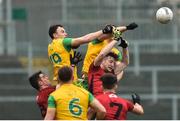 6 January 2019; Martin McElhinney and Hugh McFadden of Donegal in action against Aaron McClements and Daniel McCarthy of Down during the Bank of Ireland Dr McKenna Cup Round 2 match between Down and Donegal at Pairc Esler, Newry, Co. Down. Photo by Oliver McVeigh/Sportsfile