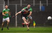 6 January 2019; Brian Reape of Mayo shoots to score his side's first goal despite the attention of Fergal McTague of Leitrim during the Connacht FBD League Preliminary Round match between Leitrim and Mayo at Avantcard Páirc Seán Mac Diarmada in Carrick-on-Shannon, Co Leitrim. Photo by Stephen McCarthy/Sportsfile