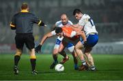 9 January 2019; Connaire Mackin of Armagh in action against Gavin Doogan and Barry Kerr, right, of Monaghan, as referee Barry Cassidy looks on, during the Bank of Ireland Dr McKenna Cup Round 3 match between Armagh and Monaghan at the Athletic Grounds in Armagh. Photo by Piaras Ó Mídheach/Sportsfile