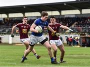 12 January 2019; Peter Hanley of Longford in action against Sam Duncan, left, and David Lynch of Westmeath during the Bord na Mona O'Byrne Cup semi-final match between Westmeath and Longford at Downs GAA Club in Westmeath. Photo by Sam Barnes/Sportsfile