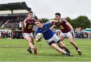 12 January 2019; Peter Hanley of Longford in action against Sam Duncan, left, and David Lynch of Westmeath during the Bord na Mona O'Byrne Cup semi-final match between Westmeath and Longford at Downs GAA Club in Westmeath. Photo by Sam Barnes/Sportsfile