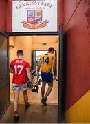 12 January 2019; Clare captain Gary Brennan makes his way into the Clare dressing room with the cup as Kevin O'Donovan of Cork returns to the Cork dressing room after the McGrath Cup Final match between Cork and Clare at Hennessy Park in Miltown Malbay, Co. Clare. Photo by Diarmuid Greene/Sportsfile