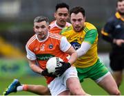 13 January 2019; Ryan McShane of Armagh in action against Martin McElhinney of Donegal during the Bank of Ireland Dr McKenna Cup semi-final match between Donegal and Armagh at Healy Park in Tyrone. Photo by Oliver McVeigh/Sportsfile