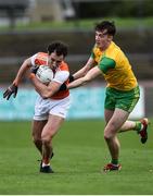 13 January 2019; Stephen Sheridan of Armagh in action against Jason McGee of Donegal during the Bank of Ireland Dr McKenna Cup semi-final match between Donegal and Armagh at Healy Park in Tyrone. Photo by Oliver McVeigh/Sportsfile