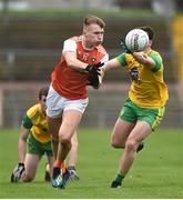 13 January 2019; Rian O'Neill of Armagh in action against Jamie Brennan of Donegal during the Bank of Ireland Dr McKenna Cup semi-final match between Donegal and Armagh at Healy Park in Tyrone. Photo by Oliver McVeigh/Sportsfile
