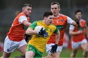 13 January 2019; Jamie Brennan of Donegal in action against Ryan McShane and Mark Shields of Armagh during the Bank of Ireland Dr McKenna Cup semi-final match between Donegal and Armagh at Healy Park in Tyrone. Photo by Oliver McVeigh/Sportsfile