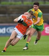13 January 2019; Rian O'Neill of Armagh in action against Brendan McCole of Donegal during the Bank of Ireland Dr McKenna Cup semi-final match between Donegal and Armagh at Healy Park in Tyrone. Photo by Oliver McVeigh/Sportsfile