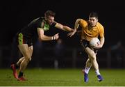 18 January 2019; David Garland of DCU Dóchas Éireann in action against Niall Hughes of IT Carlow during the Electric Ireland Sigerson Cup Round 1 match between DCU Dóchas Éireann and IT Carlow at Dublin City University Sportsgrounds in Dublin. Photo by Harry Murphy/Sportsfile
