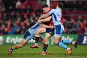 19 January 2019; Rory Scannell of Munster is tackled by Joe Simmonds, left, and Alec Hepburn of Exeter Chiefs during the Heineken Champions Cup Pool 2 Round 6 match between Munster and Exeter Chiefs at Thomond Park in Limerick. Photo by Brendan Moran/Sportsfile