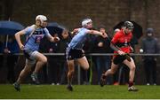 23 January 2019; Shane Conway of UCC escapes the tackle of Huw Lawlor and David Fitzgerald, left, of UCD during the Electric Ireland Fitzgibbon Cup Group A Round 2 match between University College Cork and University College Dublin at Mardyke in Cork. Photo by Stephen McCarthy/Sportsfile