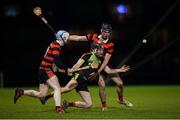 24 January 2019; Jason Cleere of IT Carlow in action against Daniel Long, left, and Andrew Kavanagh of Trinity during the Electric Ireland Fitzgibbon Cup Group B Round 2 match between Trinity and IT Carlow at the Trinity College Sports Grounds in Santry Demesne, Dublin. Photo by Stephen McCarthy/Sportsfile