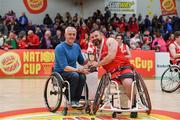 25 January 2019; Rebel Wheelers captain Paul Ryan is presented with the cup by Chairman of IWA Basketball Barry Cook after the Hula Hoops IWA Cup Final match between Ballybrack Bulls and Rebel Wheelers at the National Basketball Arena in Tallaght, Dublin. Photo by Brendan Moran/Sportsfile