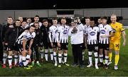 25 January 2019; Dundalk players and supporter Cillian Moran with the trophy following their victory during the Jim Malone Cup match between Dundalk and Drogheda United at Oriel Park in Dundalk, Co. Louth. Photo by Seb Daly/Sportsfile