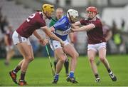 27 January 2019; Ryan Mullaney of Laois in action against Sean Bleahene, left, and Thomas Monaghan of Galway during the Allianz Hurling League Division 1B Round 1 match between Galway and Laois at Pearse Stadium in Galway. Photo by Ray Ryan/Sportsfile
