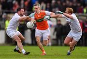 27 January 2019; Mark Shields of Armagh in action against Fergal Conway, left, and Keith Cribbin of Kildare during the Allianz Football League Division 2 Round 1 match between Kildare and Armagh at St Conleth's Park in Newbridge, Kildare. Photo by Piaras Ó Mídheach/Sportsfile