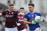 27 January 2019; Conor Madden of Cavan in action against Sean Andy O'Ceallaigh of Galway during the Allianz Football League Division 1 Round 1 match between Galway and Cavan at Pearse Stadium in Galway. Photo by Ray Ryan/Sportsfile