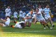 28 January 2019; Sam Small of Blackrock College goes over to score his side's second try despite the attempted tackle from Christopher Lawless, left, and Callum McNulty of Presentation College Bray during the Bank of Ireland Leinster Schools Senior Cup Round 1 match between Presentation College Bray and Blackrock College at Energia Park in Dublin. Photo by David Fitzgerald/Sportsfile