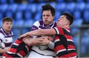 30 January 2019; Flyn Kiernan of Clongowes Wood College is tackled by Jake Brownell, left, and Ross Chandler of Wesley College during the Bank of Ireland Leinster Schools Senior Cup Round 1 match between Wesley College and Clongowes Wood College at Energia Park in Dublin. Photo by Ben McShane/Sportsfile