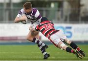 30 January 2019; Joe Carroll of Clongowes Wood College is tackled by Hugh Grant of Wesley College during the Bank of Ireland Leinster Schools Senior Cup Round 1 match between Wesley College and Clongowes Wood College at Energia Park in Dublin. Photo by Eóin Noonan/Sportsfile