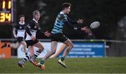 30 January 2019; James Kennedy of St Gerard's School passes off as Donal Conroy of Newbridge College looks on during the Bank of Ireland Leinster Schools Senior Cup Round 1 match between Newbridge College and St Gerard’s School at Templeville Road in Dublin. Photo by Piaras Ó Mídheach/Sportsfile