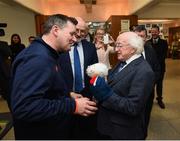 31 January 2019; President Michael D Higgins is presented with a gift from Stephen Egan, FAI Kit Coordinator, during a visit to the FAI Headquarters in Abbottstown, Dublin. Photo by Stephen McCarthy/Sportsfile