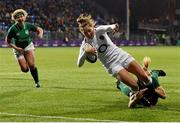 1 February 2019; Emily Scott of England on her way to scoring her side's seventh try despite the tackle of Megan Williams of Ireland during the Women's Six Nations Rugby Championship match between Ireland and England at Energia Park in Donnybrook, Dublin. Photo by Ramsey Cardy/Sportsfile