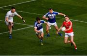 2 February 2019; Ryan Burns of Louth in action against Laois players, from left, Graham Brody, David Seale, and Stephen Attride during the Allianz Football League Division 3 Round 2 match between Laois and Louth at Croke Park in Dublin. Photo by Piaras Ó Mídheach/Sportsfile