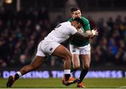 2 February 2019; Jonathan Sexton of Ireland is tackled by Manu Tuilagi of England during the Guinness Six Nations Rugby Championship match between Ireland and England in the Aviva Stadium in Dublin. Photo by Ramsey Cardy/Sportsfile