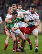 3 February 2019; Ciaran Treacy of Mayo in action against Kieran McGeary, left, and Matthew Donnelly of Tyrone during the Allianz Football League Division 1 Round 2 match between Tyrone and Mayo at Healy Park in Omagh, Tyrone. Photo by Oliver McVeigh/Sportsfile