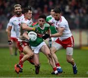 3 February 2019; Ciaran Treacy of Mayo  in action against Kieran McGeary, left, and Matthew Donnelly of Tyrone during the Allianz Football League Division 1 Round 2 match between Tyrone and Mayo at Healy Park in Omagh, Tyrone. Photo by Oliver McVeigh/Sportsfile
