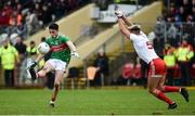 3 February 2019; Ciaran Treacy of Mayo shoots to score a point despite the attention of Tiernan McCann of Tyrone during the Allianz Football League Division 1 Round 2 match between Tyrone and Mayo at Healy Park in Omagh, Tyrone. Photo by Oliver McVeigh/Sportsfile