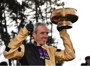 3 February 2019; Jockey Ruby Walsh celebrates with the trophy after winning the Unibet Irish Gold Cup on Bellshill during Day Two of the Dublin Racing Festival at Leopardstown Racecourse in Dublin. Photo by Seb Daly/Sportsfile