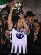 9 February 2019; Dundalk captain Brian Gartland lifts the President's Cup following the 2019 President's Cup Final between Cork City and Dundalk at Turners Cross in Cork. Photo by Stephen McCarthy/Sportsfile