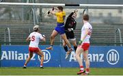 10 February 2019; Ultan Harney of Roscommon outjumps Tyrone goalkeeper Niall Morgan to score his side's first goal during the Allianz Football League Division 1 Round 3 match between Roscommon and Tyrone at Dr. Hyde Park in Roscommon. Photo by Seb Daly/Sportsfile