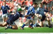 28 September 2003; Colm Kelly, Laois, gets around Dublin goalkeeper Kieran Walsh to score his sides goal. All-Ireland Minor Football Championship Final, Dublin v Laois, Croke Park, Dublin. Picture credit; Ray McManus / SPORTSFILE