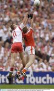 28 September 2003; Francie Bellew, Armagh, in action against Tyrone's Brian McGuigan. Bank of Ireland All-Ireland Senior Football Championship Final, Armagh v Tyrone, Croke Park, Dublin. Picture credit; Matt Browne / SPORTSFILE *EDI*