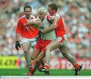 28 September 2003; Owen Mulligan, Tyrone, in action against Armagh's Francie Bellew. Bank of Ireland All-Ireland Senior Football Championship Final, Armagh v Tyrone, Croke Park, Dublin. Picture credit; Brendan Moran / SPORTSFILE