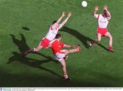 28 September 2003; Diarmaid Marsden, Armagh in action against Tyrone's Conor Gormley and Ciaran Gourley, right. Bank of Ireland All-Ireland Senior Football Championship Final, Armagh v Tyrone, Croke Park, Dublin. Picture credit; Ray McManus / SPORTSFILE