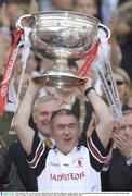 28 September 2003; Tyrone manager Mickey Harte lifts the Sam Maguire cup after victory over Armagh. Bank of Ireland All-Ireland Senior Football Championship Final, Armagh v Tyrone, Croke Park, Dublin. Picture credit; Matt Browne / SPORTSFILE *EDI*
