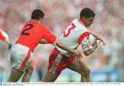 28 September 2003; Enda McGinley, Tyrone, in action against Armagh's Andy Mallon. Bank of Ireland All-Ireland Senior Football Championship Final, Armagh v Tyrone, Croke Park, Dublin. Picture credit; Brendan Moran / SPORTSFILE