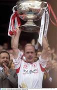 28 September 2003; Tyrone captain Peter Canavan lifts the Sam Maguire cup. Bank of Ireland All-Ireland Senior Football Championship Final, Armagh v Tyrone, Croke Park, Dublin. Picture credit; David Maher / SPORTSFILE *EDI*