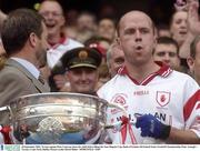 28 September 2003; Tyrone captain Peter Canavan shows his relief before lifting the Sam Maguire Cup. Bank of Ireland All-Ireland Senior Football Championship Final, Armagh v Tyrone, Croke Park, Dublin. Picture credit; David Maher / SPORTSFILE *EDI*