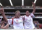 28 September 2003; Kevin Hughes, left, Tyrone, with team-mate Brian McGuigan celebrate at the end of the game after victory over Armagh. Bank of Ireland All-Ireland Senior Football Championship Final, Armagh v Tyrone, Croke Park, Dublin. Picture credit; David Maher / SPORTSFILE *EDI*