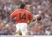 28 September 2003; Diarmaid Marsden, Armagh, pictured after hitting Philip Jordan of Tyrone before he was sent off by referee Brian White. Bank of Ireland All-Ireland Senior Football Championship Final, Armagh v Tyrone, Croke Park, Dublin. Picture credit; Matt Browne / SPORTSFILE *EDI*