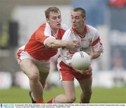 28 September 2003; Brian McGuigan, Tyrone, in action against Armagh's John McEntee. Bank of Ireland All-Ireland Senior Football Championship Final, Armagh v Tyrone, Croke Park, Dublin. Picture credit; Matt Browne / SPORTSFILE *EDI*