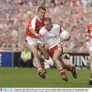 28 September 2003; Philip Jordan, Tyrone, in action against Armagh's Philip Loughran. Bank of Ireland All-Ireland Senior Football Championship Final, Armagh v Tyrone, Croke Park, Dublin. Picture credit; Matt Browne / SPORTSFILE *EDI*